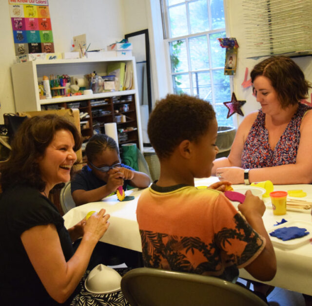 Children's Safety Project staff doing crafts with a student.